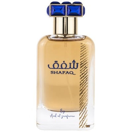 Parfum Ard Al Zaafaran Shafaq, flacon transparent cu lichid auriu și dop albastru